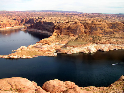 body of water surrounded by mountain thumbnail