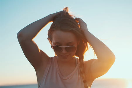 woman holding his hair thumbnail