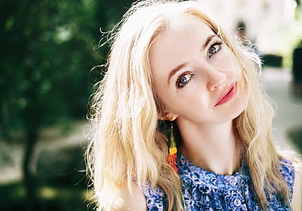 woman wearing blue and purple floral top thumbnail