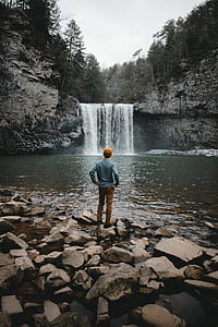 man facing backward looking at falls thumbnail