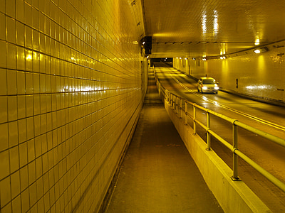 yellow vehicle traveling inside the tunnel thumbnail