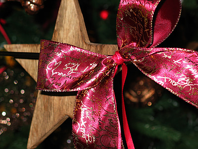 close-up photo of red and brown bow on brown wooden star thumbnail