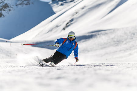 Man Snow Skiing on Bed of Snow during Winter thumbnail