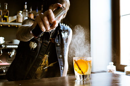 man pouring liquid on glass thumbnail