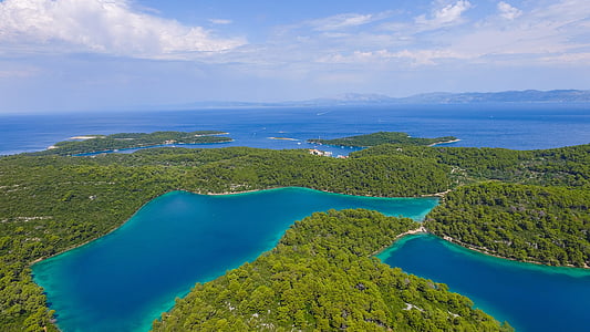 body of water near mountains photography thumbnail