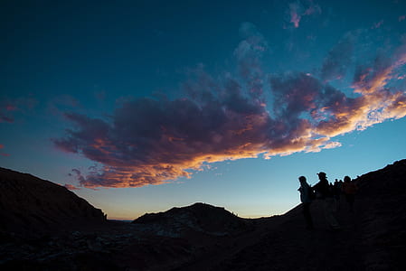 person on top of mountain during sunset thumbnail