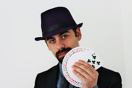 man holding a playing cards thumbnail