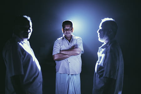 three men wearing white button-up t-shirts thumbnail