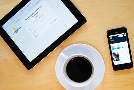 black Android smartphone beside black Android tablet computer thumbnail