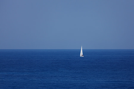 white sailboat on body of water during daytime thumbnail