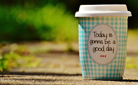 teal and white plastic cup with lid in selective focus photography thumbnail