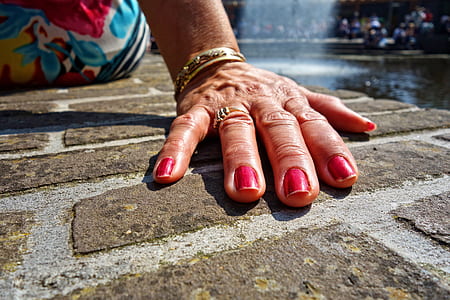 person sitting near fountain thumbnail