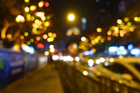 bookeh photography of lighted streets with vehicles thumbnail