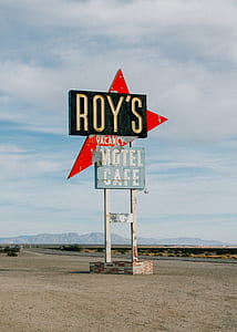 Roy's Vacancy motel cafe signage near road thumbnail