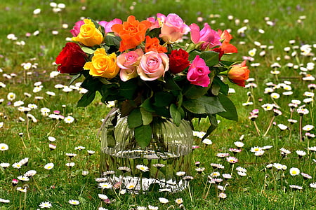 multicolored flowers in a clear glass vase thumbnail