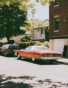 red coupe during daytime thumbnail