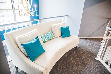white wooden framed blue padded sofa thumbnail