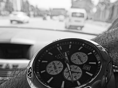 grayscale photography of person wearing Citizen chronograph watch thumbnail