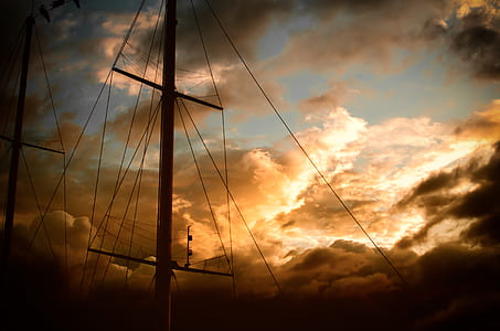 silhouette of electric post during golden hour thumbnail