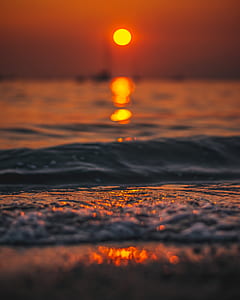body of water during sunset thumbnail