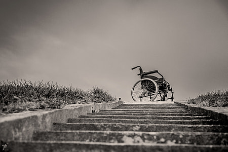 greyscale photography of stairs with wheelchairs on top thumbnail