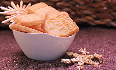 bowl of cookies on top of maroon textile thumbnail