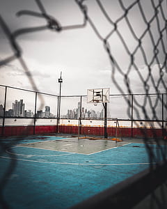 empty basketball court with cloudy sky thumbnail