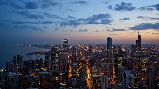 Aerial view of city buildings during sunset thumbnail