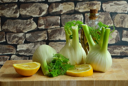 bunch of vegetable and slice lemon on beige table thumbnail