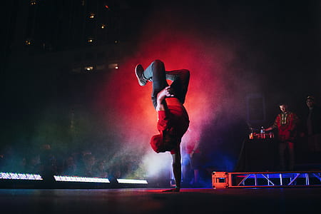 man doing hand stand on stage thumbnail