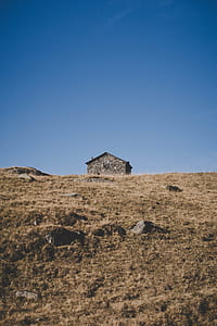 concrete house under blue sky at daytime photo thumbnail