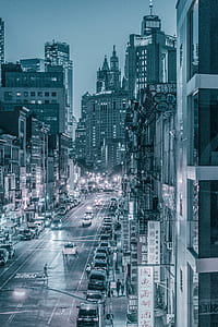 greyscale photo of road between buildings thumbnail