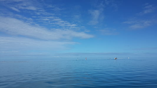 calm sea under cloudy sky thumbnail