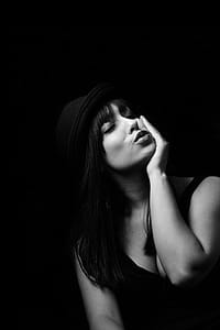 Grayscale Photography Of Woman In Tank Top Wearing Hat thumbnail