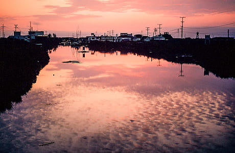 Sunset Clouds Reflection On Water with Salmon Fishing Village thumbnail