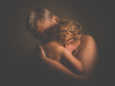 woman hugging baby in room thumbnail
