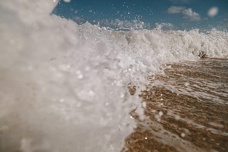 waves rushed to shore at daytime thumbnail