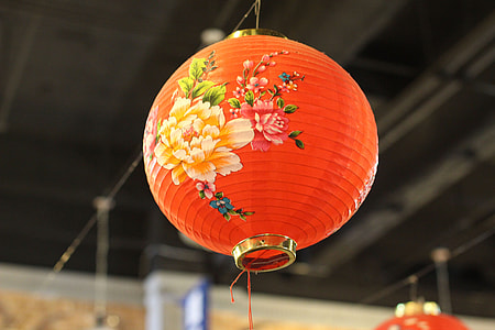 focus photo of round red and pink floral paper lantern thumbnail