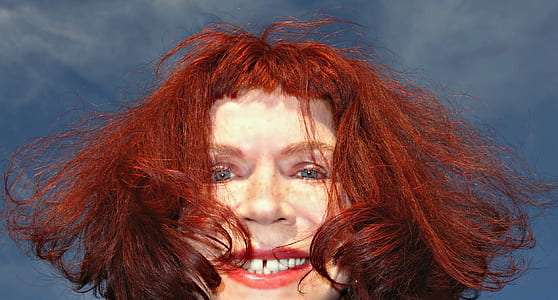 red haired person taking selfie thumbnail