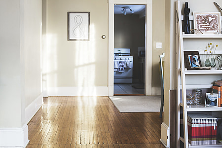house with brown parquet flooring and white wooden 4-layer rack thumbnail