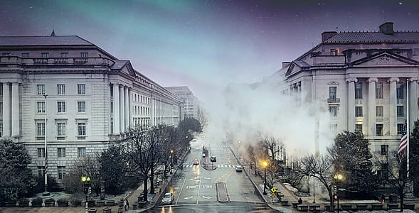 white wall paint building with smoke during daytime thumbnail