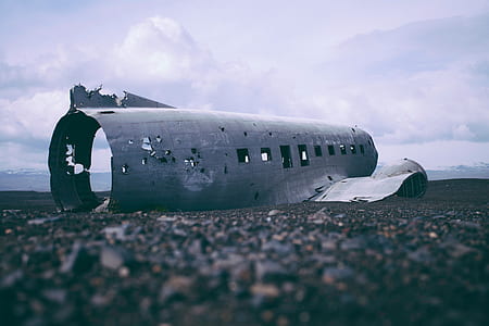 gray wrecked airliner on ground thumbnail