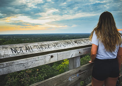 woman standing near wooden fence thumbnail