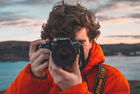 man taking photo using Nikon D200 thumbnail