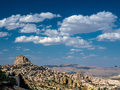 Landscape with houses in stones under sky and clouds in Cappadocia, Turkey thumbnail