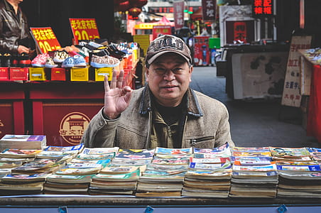 man showing hand sign thumbnail
