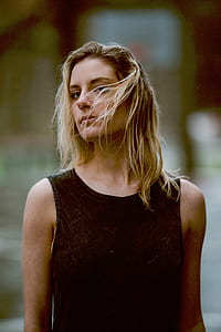 selective focus photo of woman in black sleeveless top thumbnail