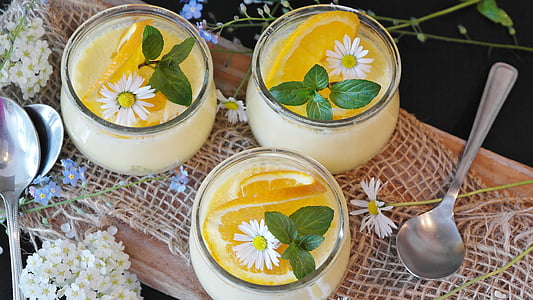 three clear glass cups with lemon juices thumbnail