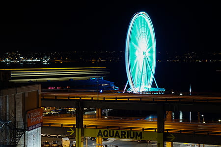time-lapse photography of ferris wheel at night time thumbnail
