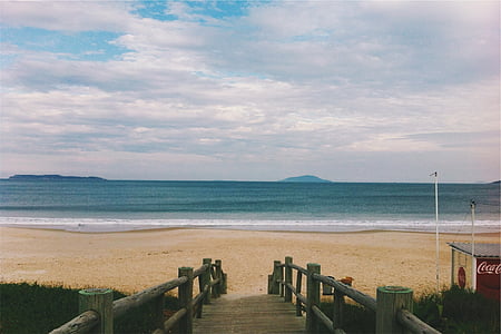 photo of boardwalk near seashore thumbnail